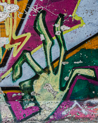 This Berlin Wall art depicts wild spindly fingers like those of some mad magician.