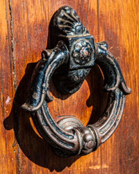 A classic knocker adorns this door in Certaldo, Italy.