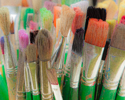 The many-hued strains of past paintings linger like memories in the bristles of these brushes.