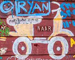 A cartoon vehicle rolls along the boards of the Hardy Gallery, Ephraim, WI.