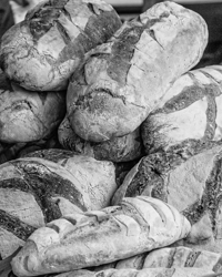 French loaves are piled high at a Chateaubriant market.