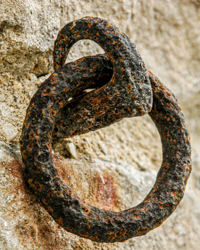 An iron spike and ring driven into the stone wall of Leeds Castle age beautifully over the centuries.