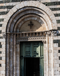 Italian marble set in layers beckons worshipers inside.