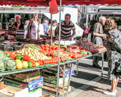 The red of the canopies blends patriotially with the blue and wshite stripes of the classic Breton shirts to celebrate the bounty of summer.