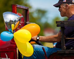 Part of the tradition of Olde Ellison Bay Days was a Saturday parade through the town, complete with a grand marshal, Viking boats, local floats, historic vehicles, and school bands. The antique car in this photograph, festooned with bright balloons, captures the history and pride of this quiet village at the tip of the Door County, Wisconsin, peninsula