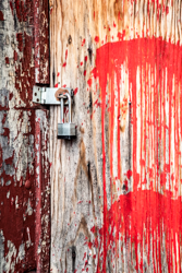 Drips of blood-red paint add dramatic character to this weathered door.
